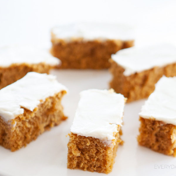 The best pumpkin bar recipe ever! This recipe makes a generous amount, is a definite crowd pleaser and perfect for Holiday potlucks or large family gatherings. #pumpkinspice #pumpkinrecipe